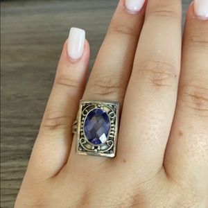 Silver ring with large blue stone